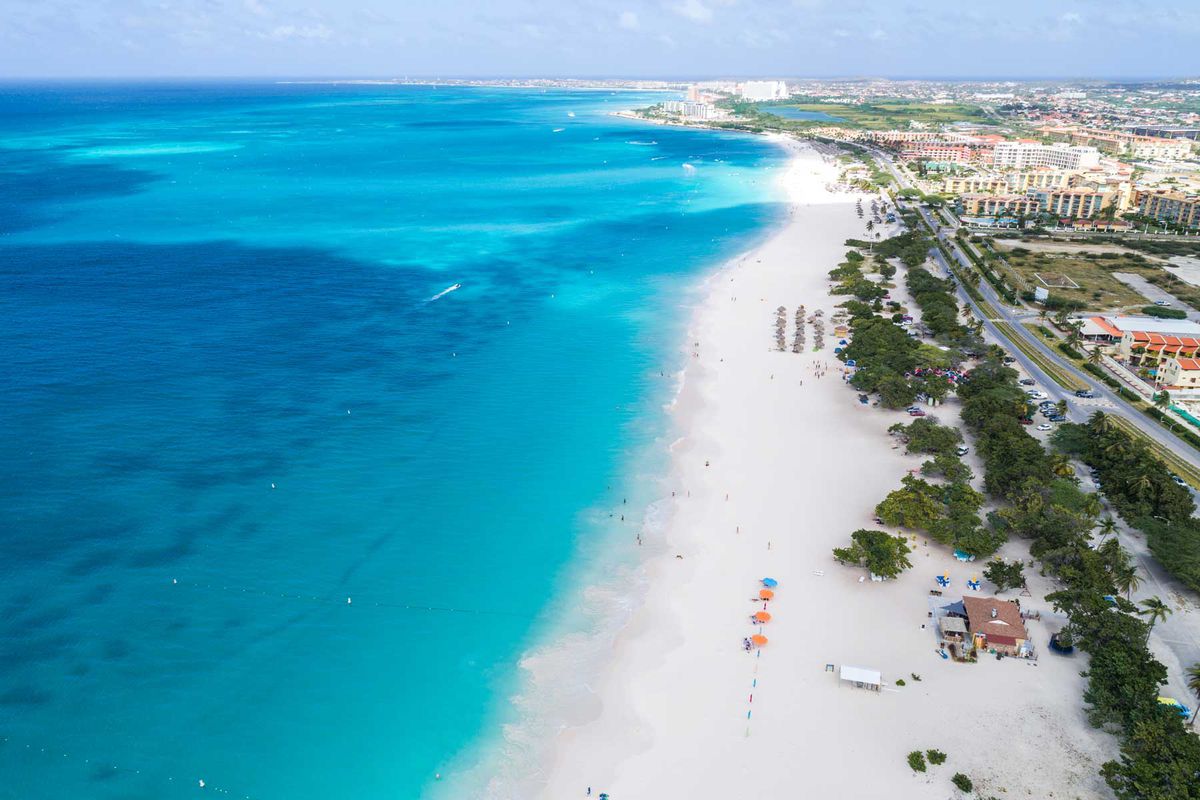 Aerial view of a resort-lined beach in Aruba