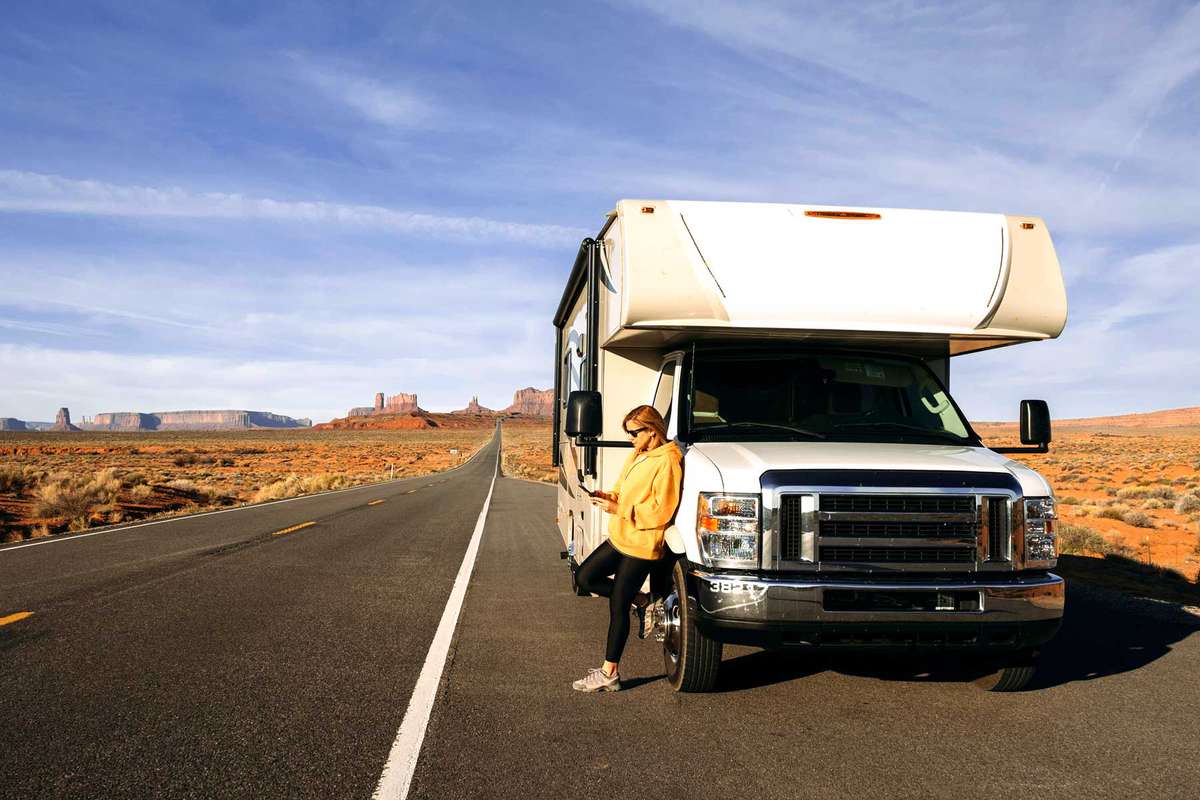 Female tourist with motorhome at Monument Valley