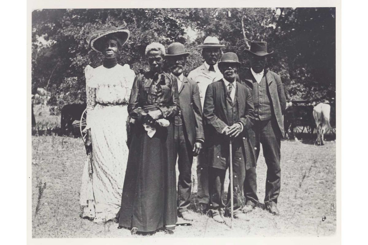Photograph of Emancipation Day celebration, June 19, 1900 held in "East Woods" on East 24th Street in Austin. Mrs. Grace Murray Stephenson also kept a diary of the day's events which she sold to the San Francisco Chronicle which reported a full-page feature on it.