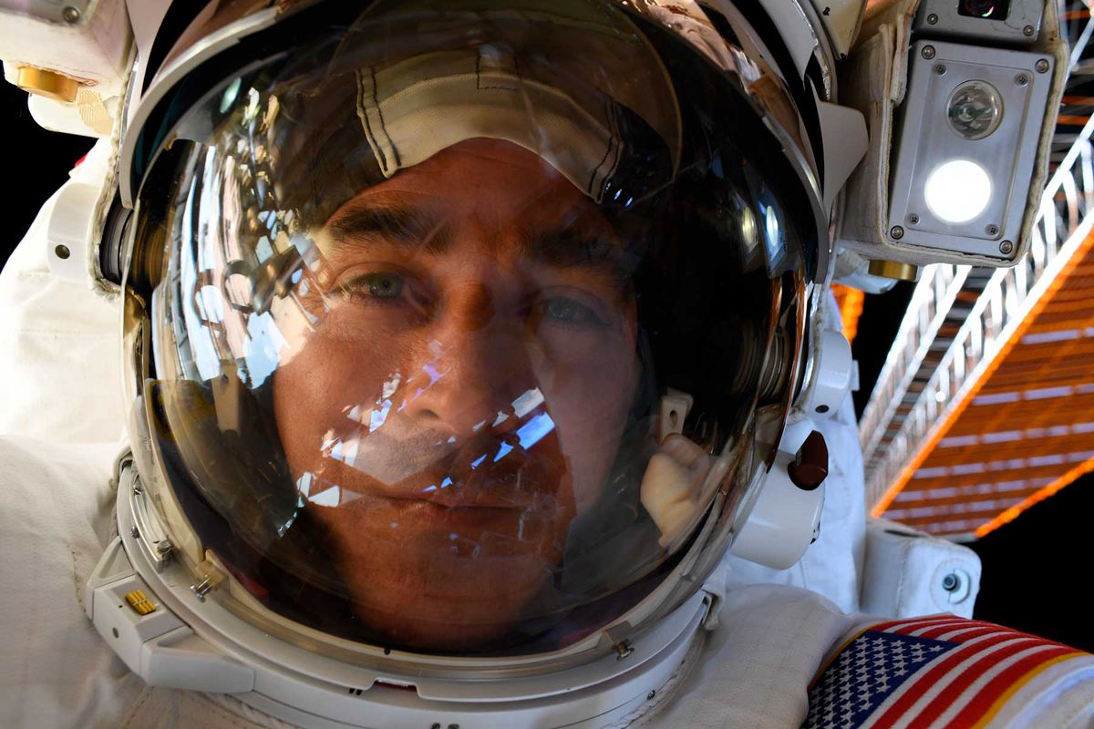 NASA Astronaut, Chris Cassidy, in space performing a space walk.