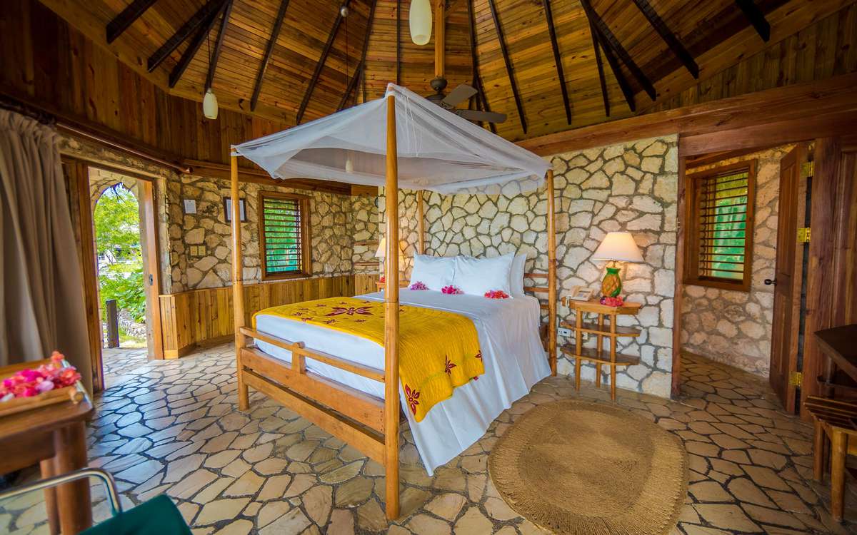 Rockhouse Resort & Spa hotel room with canopy bed