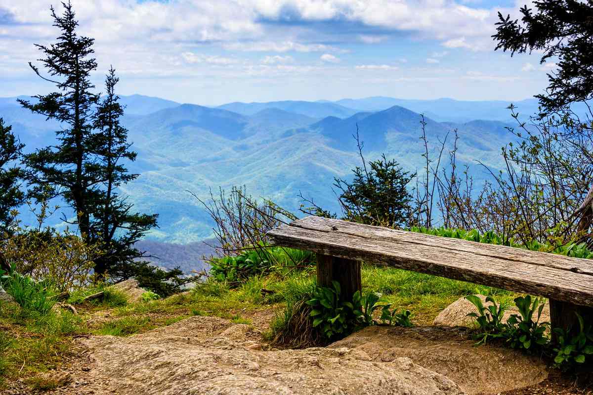 Scenic view from wooden bench of Smoky and Blue Ridge Mountains in North Carolina