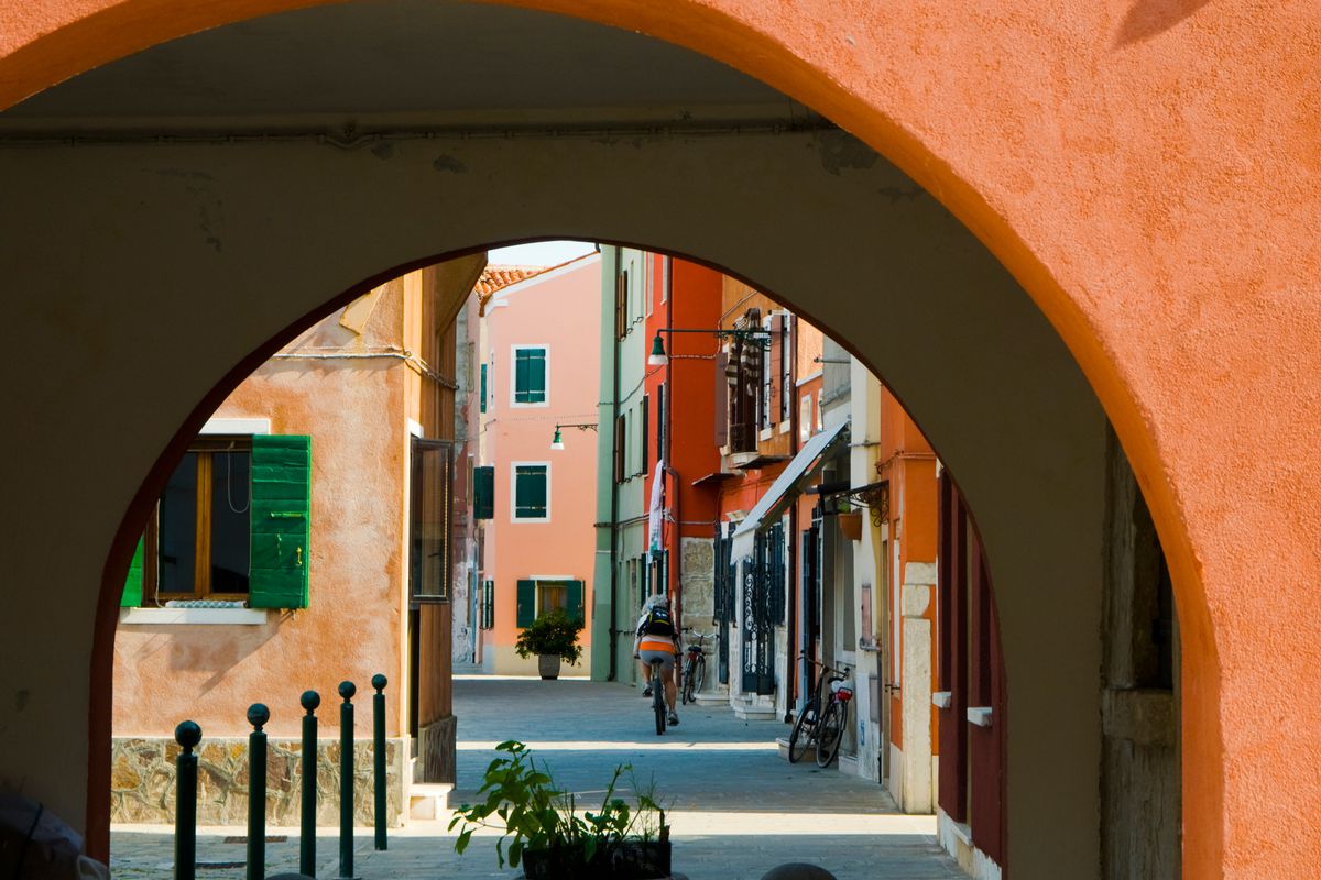 Cycling through the narrow streets of Venice, Italy.