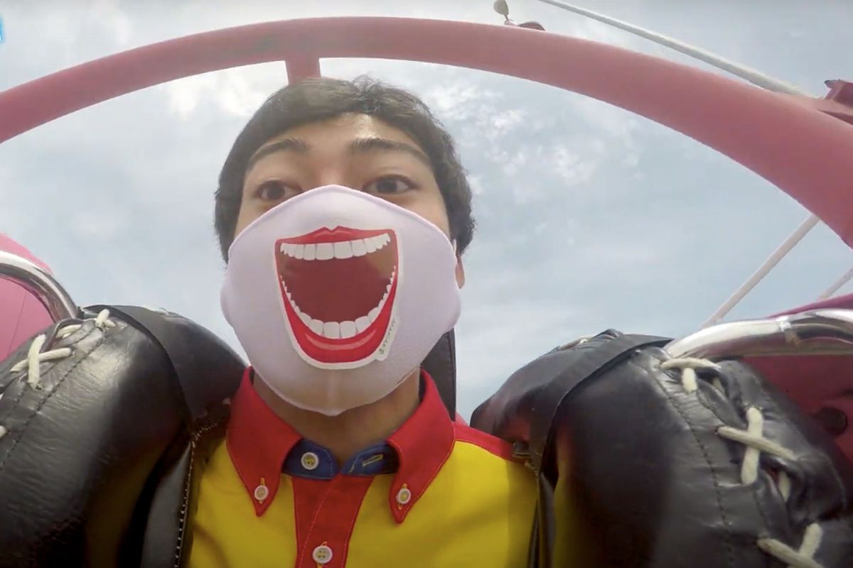 roller coaster passenger wearing mask