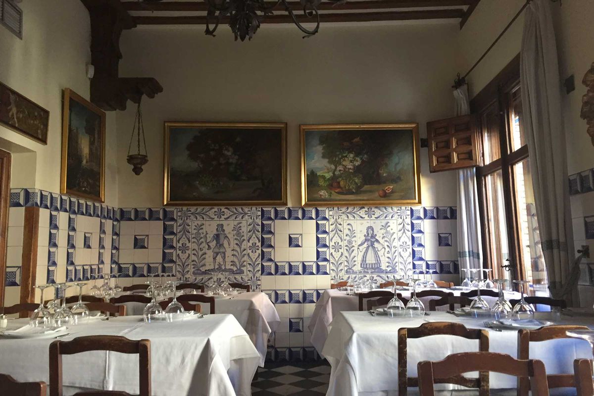 Restaurant interior in Madrid, Spain small details in tiles and white tablecloths