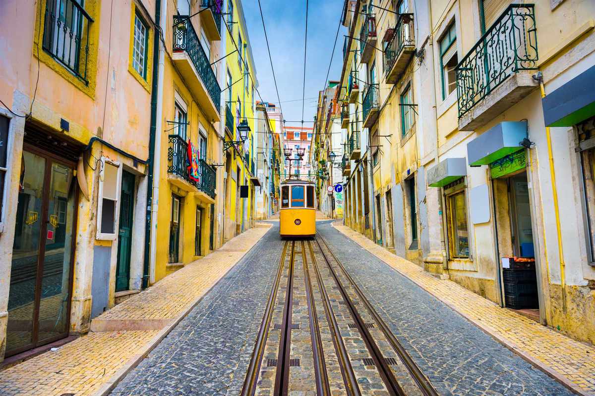 Lisbon, Portugal old town street with tram