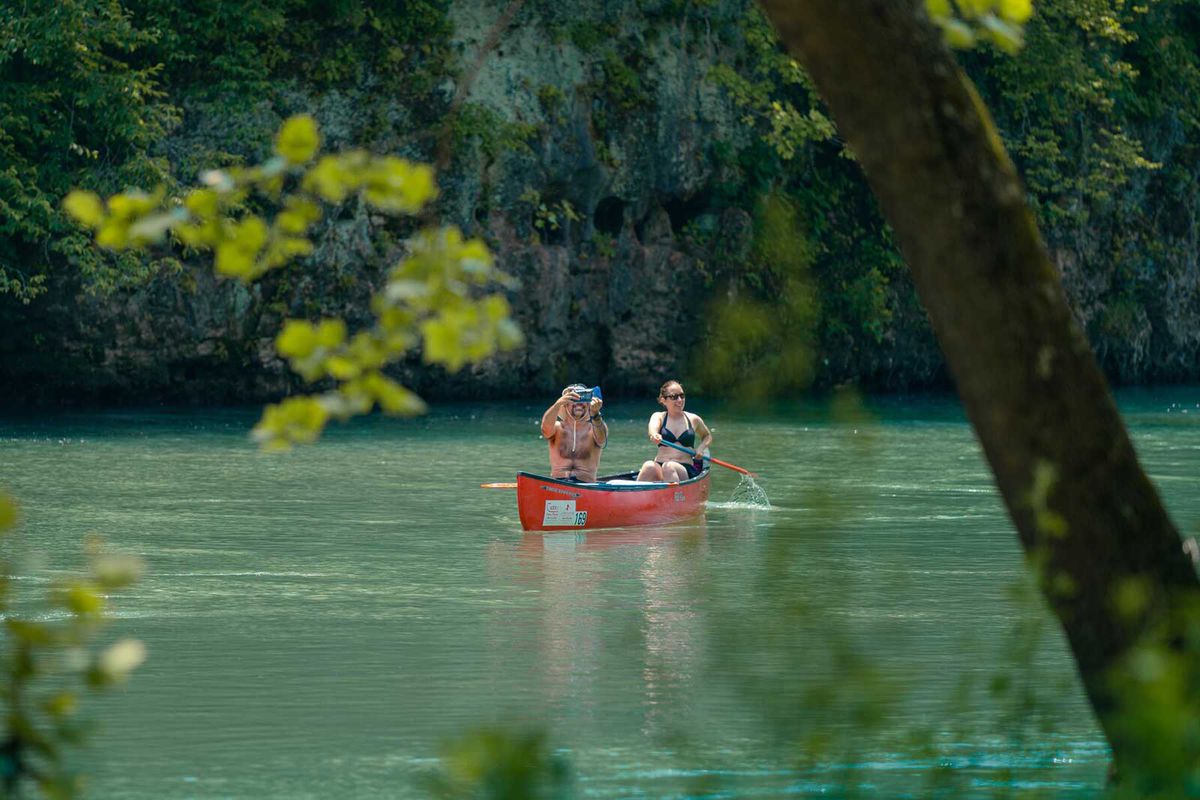 Two people canoeing on Current River in Missouri