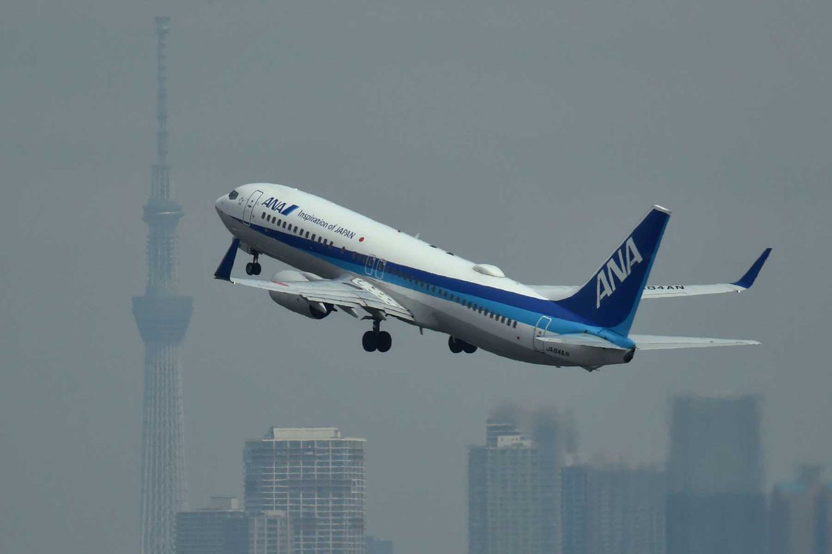 A passenger jet from Japanese carrier All Nippon Airways (ANA) takes off from Tokyo's Haneda airport on April 28, 2020