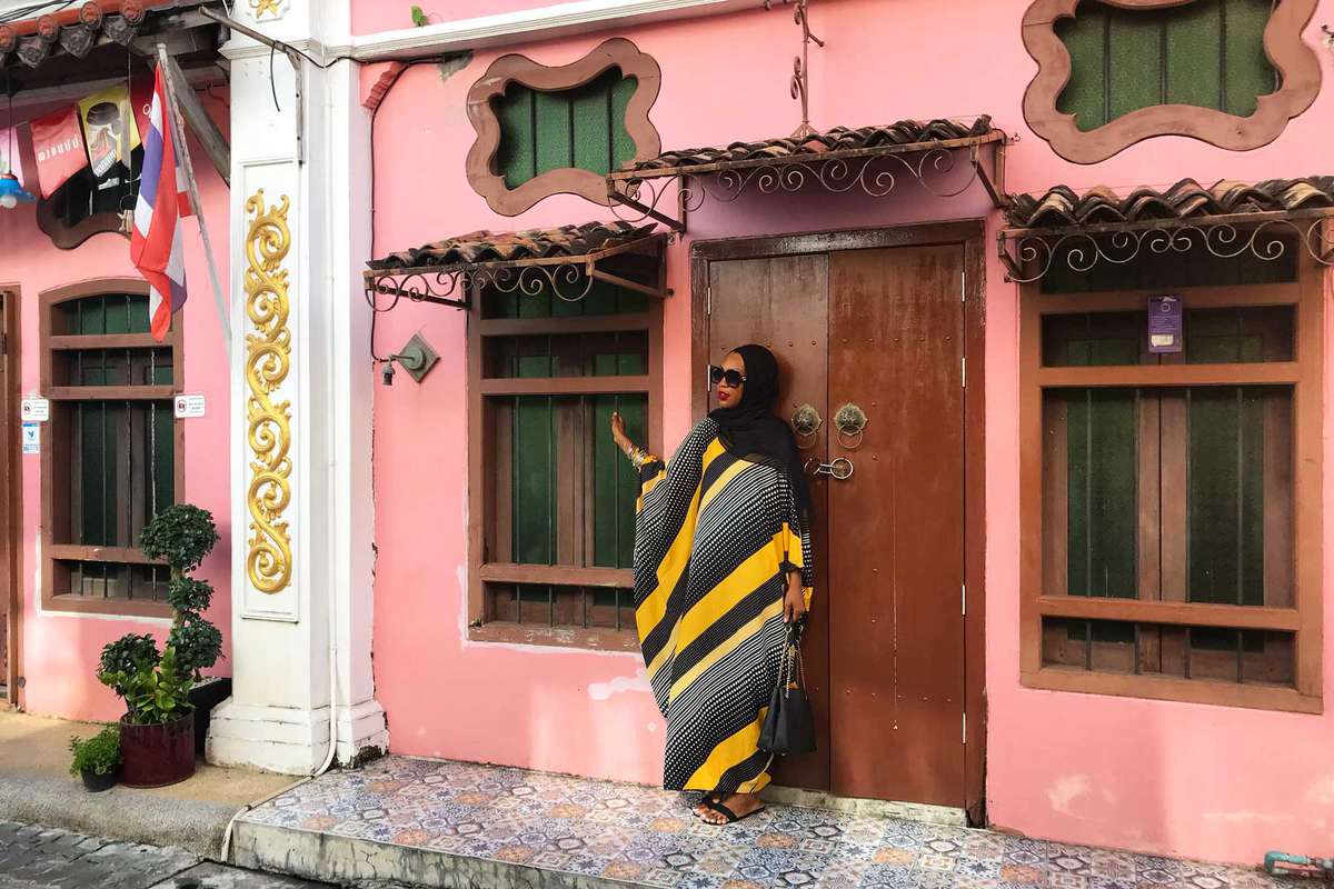 Black-American Expat, Imani Bashir standing in travel destination in hijab