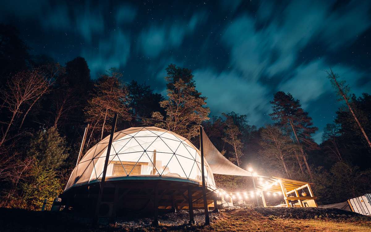 Dome room with lights under deep blue night sky