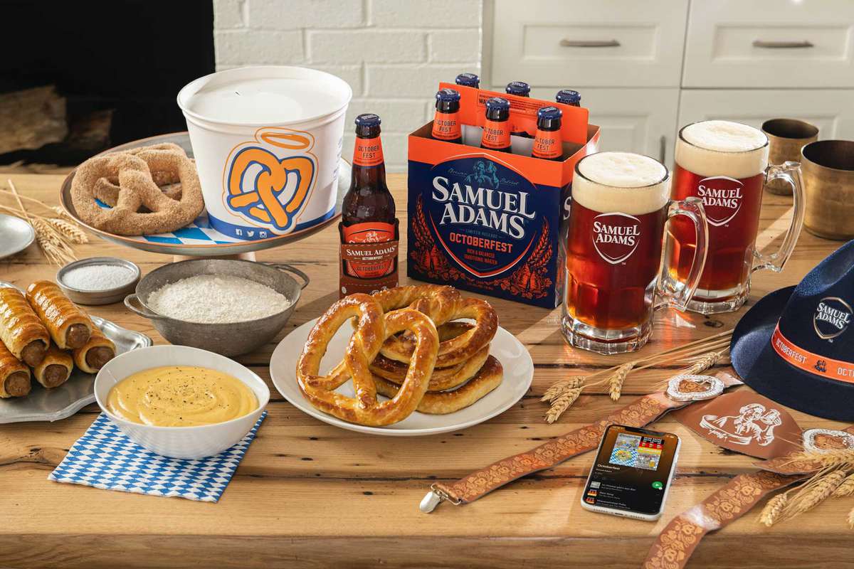 table with beer, pretzels, and Oktoberfest decorations