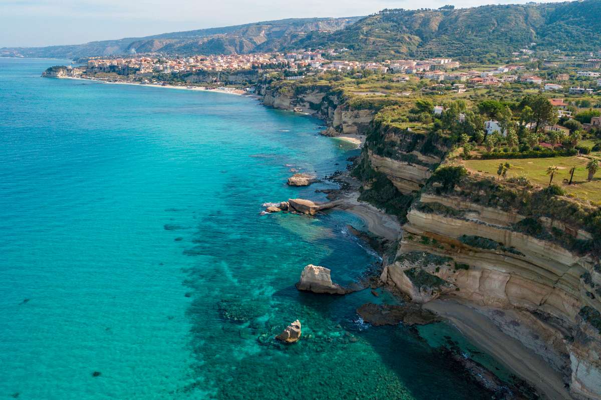 Aerial view of promontory of the Calabrian coast overlooking the sea, town of Riaci, Tropea, Calabria, Italy