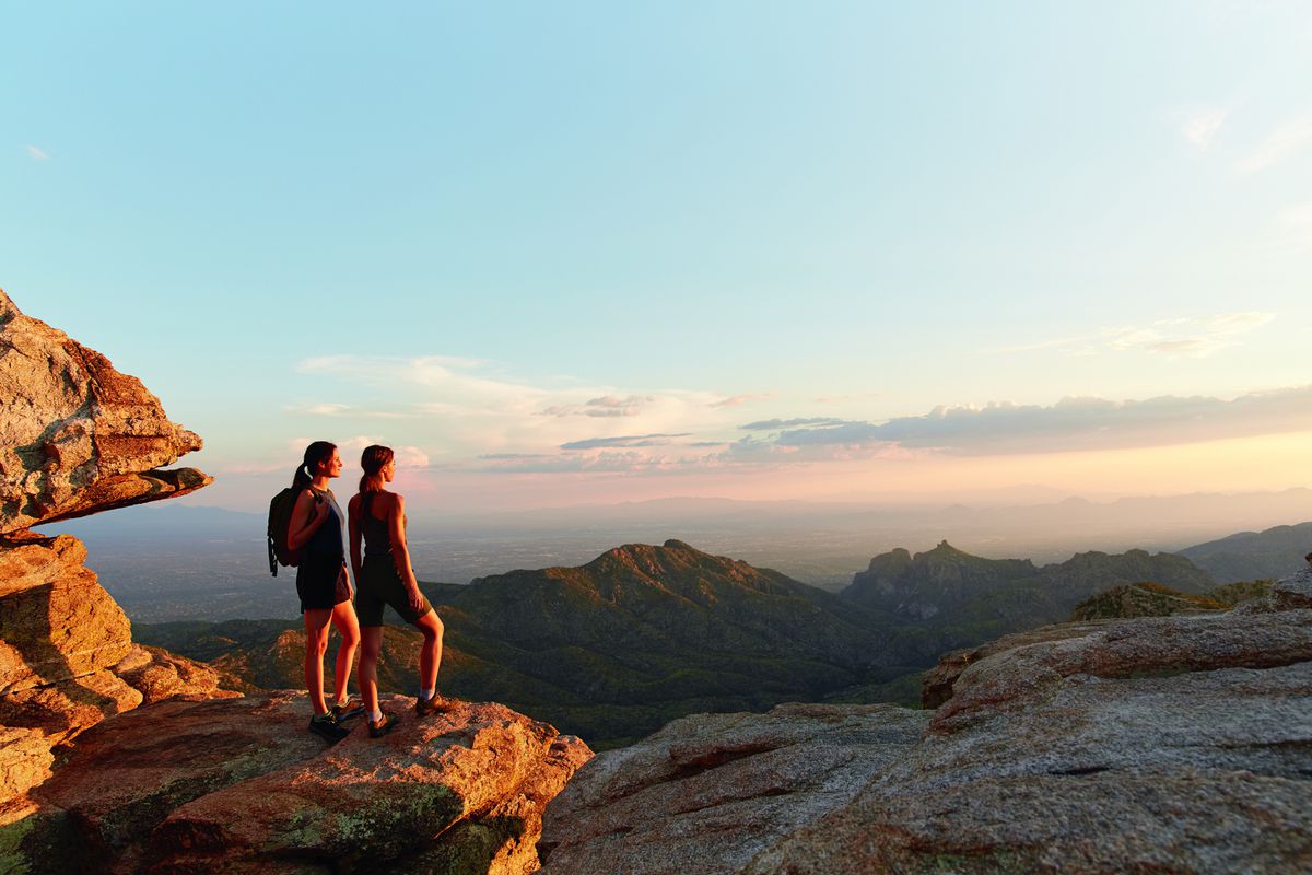 Two women hiking at Canyon Ranch Wellness Resort in Tucson, AZ