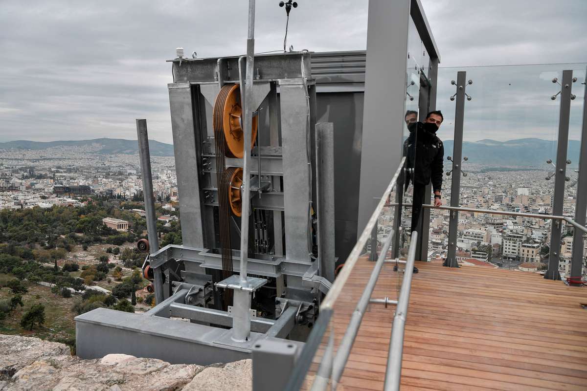 a glass elevator at the Acropolis Archaeological site