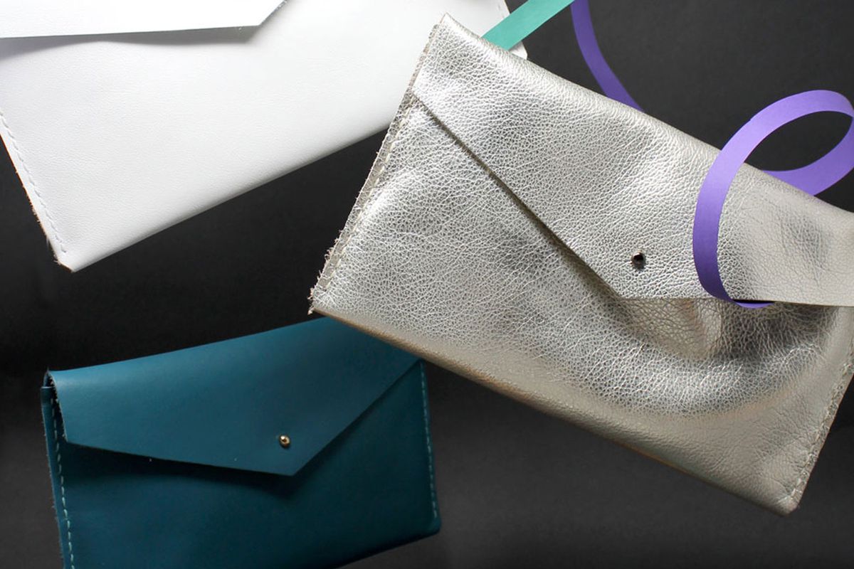 white, silver, and teal envelope clutch bags