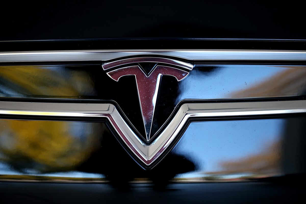 The Tesla logo is shown on the front of a new Tesla Model S