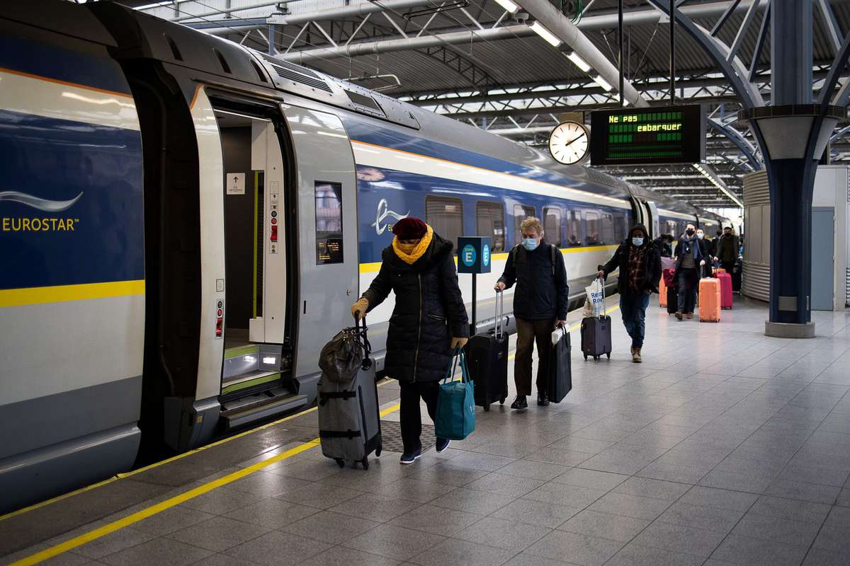 Travellers come out of a Eurostar train