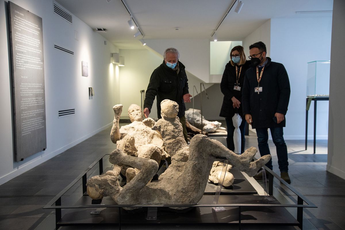 visitors view a display at The Antiquarium of the Archaeological Park of Pompeii