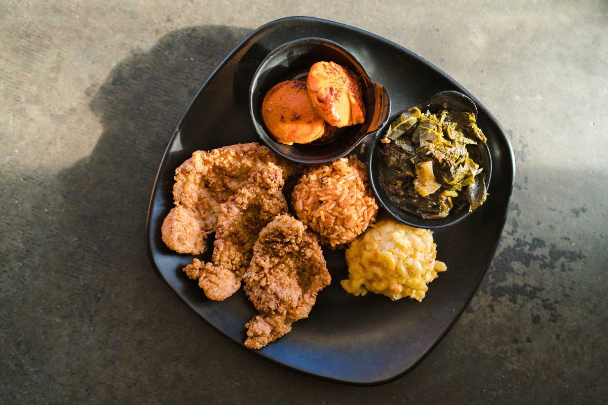 Pork chops, yams, collard greens, mac and cheese, and red rice at Nigel’s Good Food in Charleston
