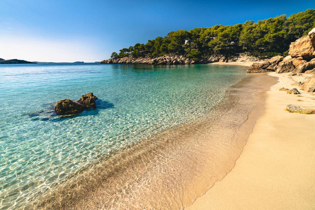 Cala Saladeta beach, west of Ibiza island in Spain.