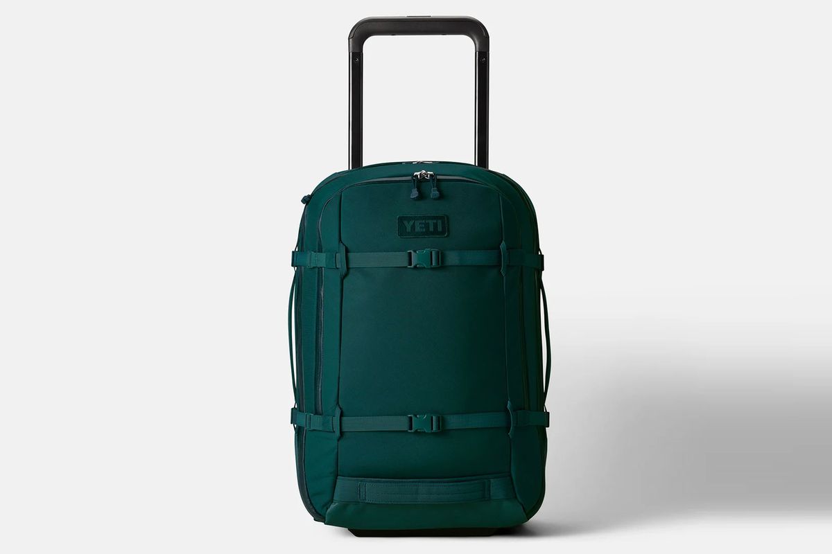 Teal/green rolling carry-on luggage