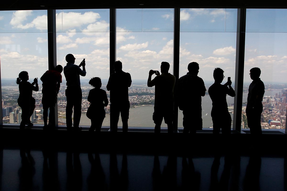People photograph the view from the One World Observatory at One World Trade Center in New York
