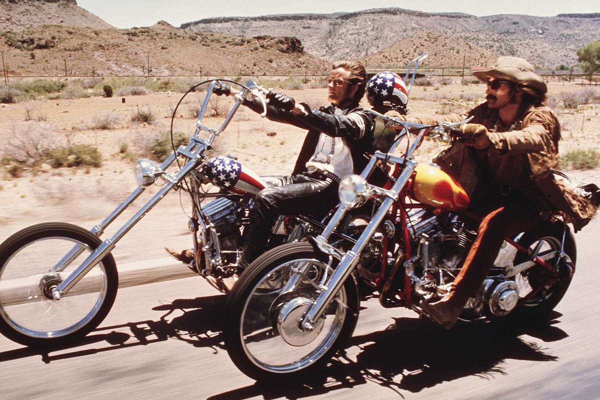 American actors Dennis Hopper and Peter Fonda ride through the Desert on motorcycles in a scene from the film 'Easy Rider', directed by Hopper, 1969.