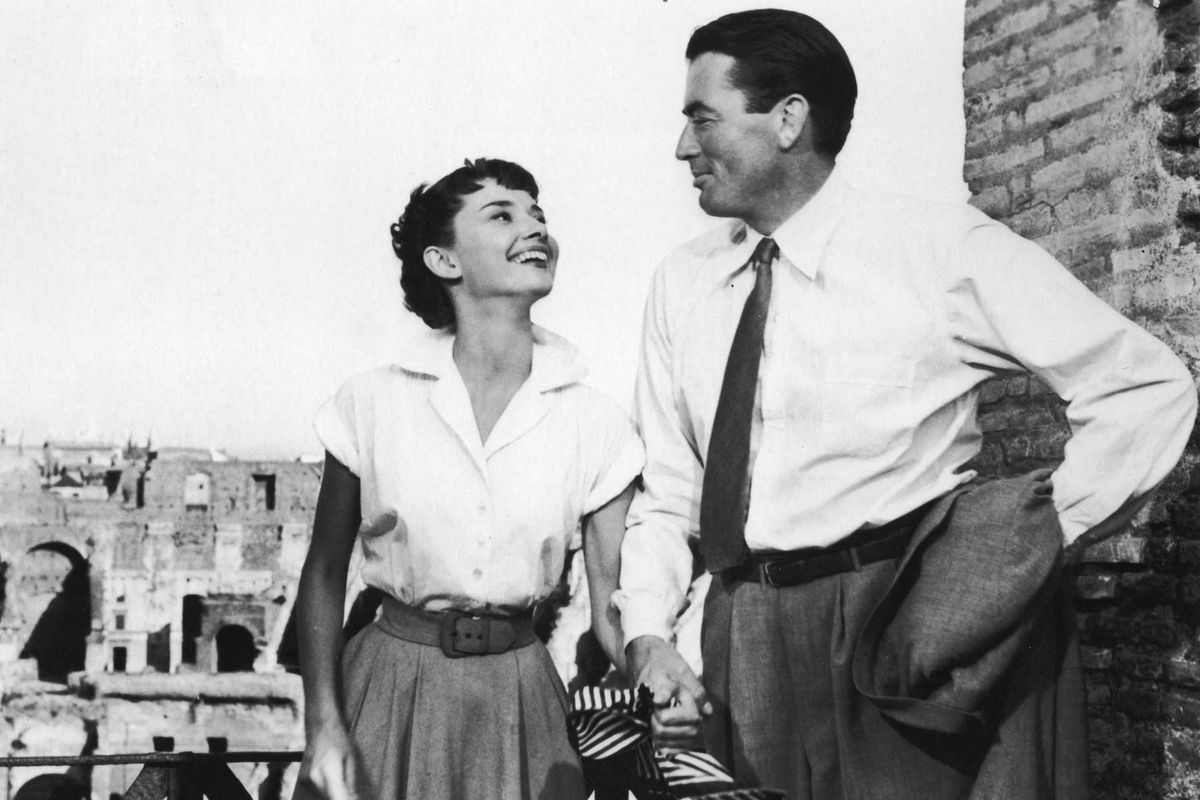 udrey Hepburn (1929-1993) holds the hand of American actor Gregory Peck in a still from the film 'Roman Holiday,' directed by William Wyler, 1953.