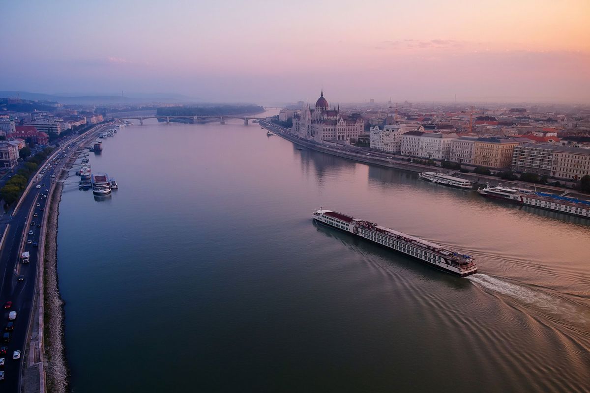 River cruise ship on the Danube river in early morning