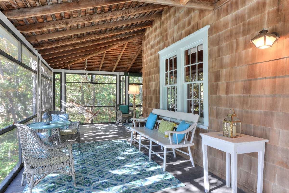 Screened in porch with furniture