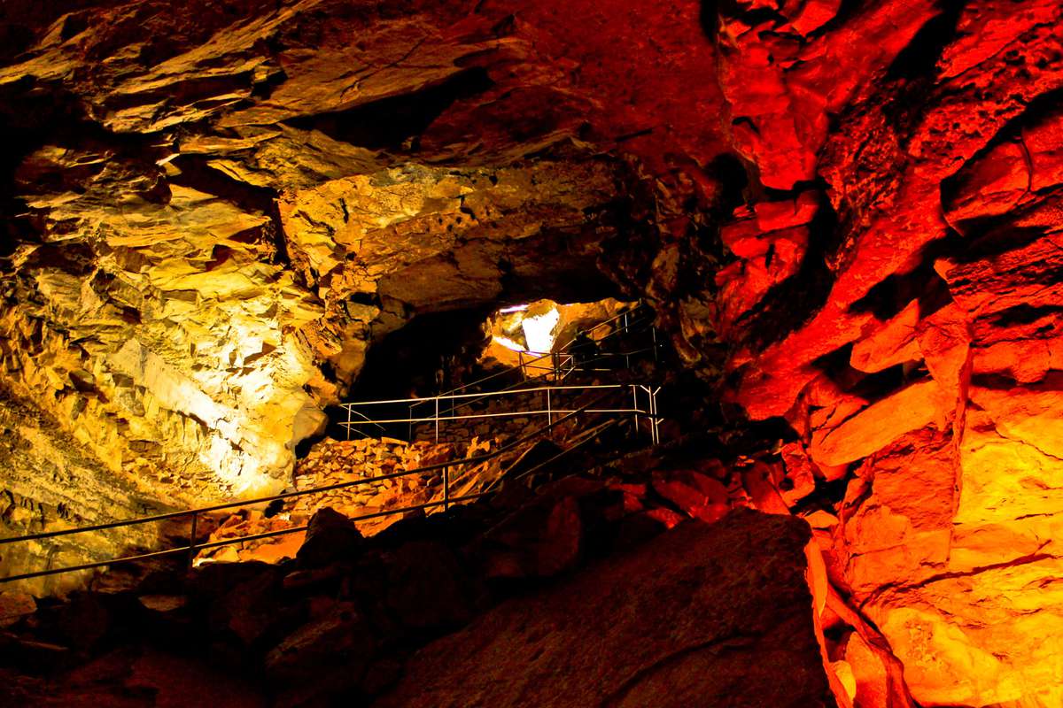 yellow and red lights inside cave
