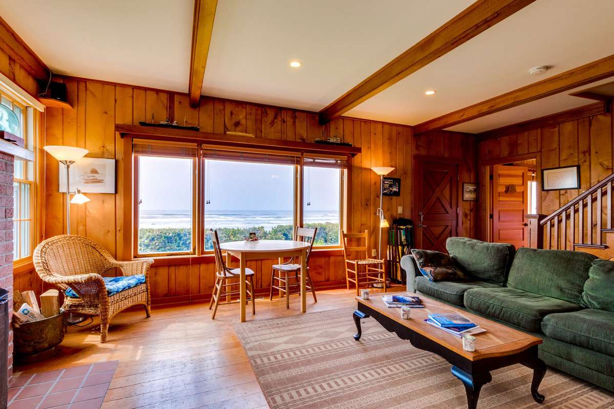 Wood paneled living room with ocean view