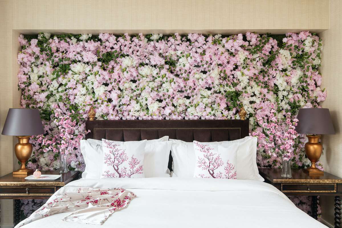 St. Regis hotel bed covered in cherry blossoms