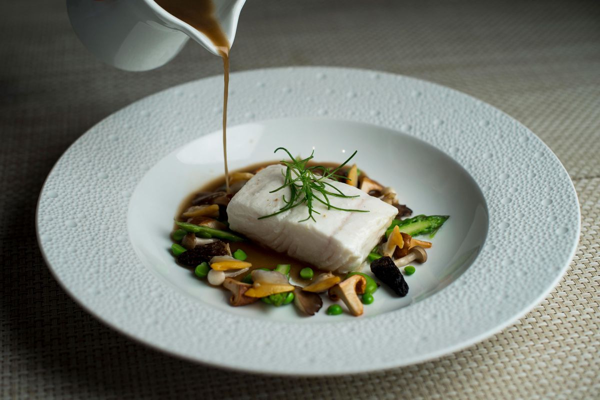Poached Halibut with manila clams and chanterelle at Le Bernardin in Manhattan, New York