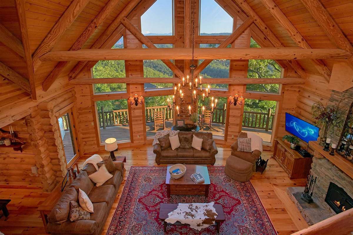 Interior of log cabin with large windows