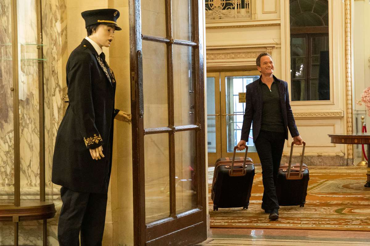 Neil Patrick Harris walking through hotel lobby