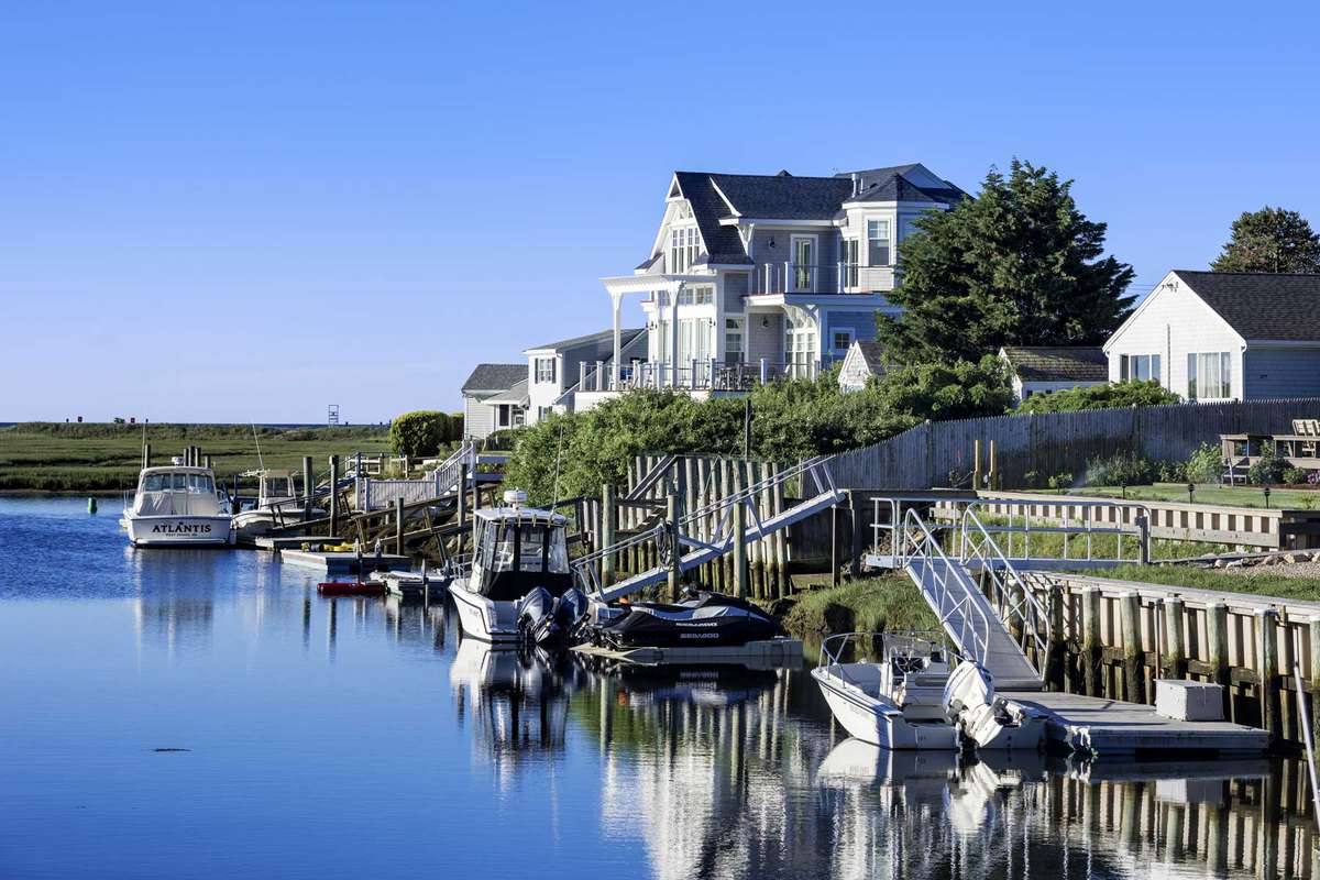 Charming canal waterfront house at West Dennis on Cape Cod in Massachusetts.