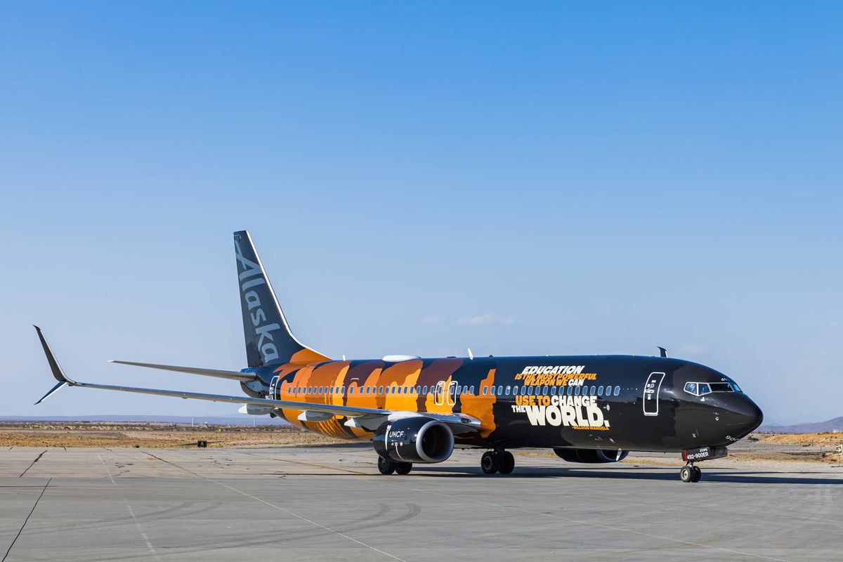 Alaska Airlines livery with faces of African American children silhouettes and quotes