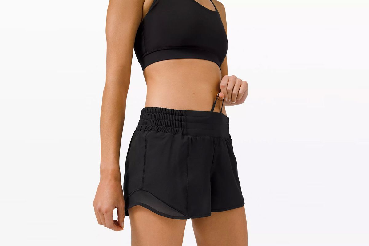 Woman wearing black running shorts