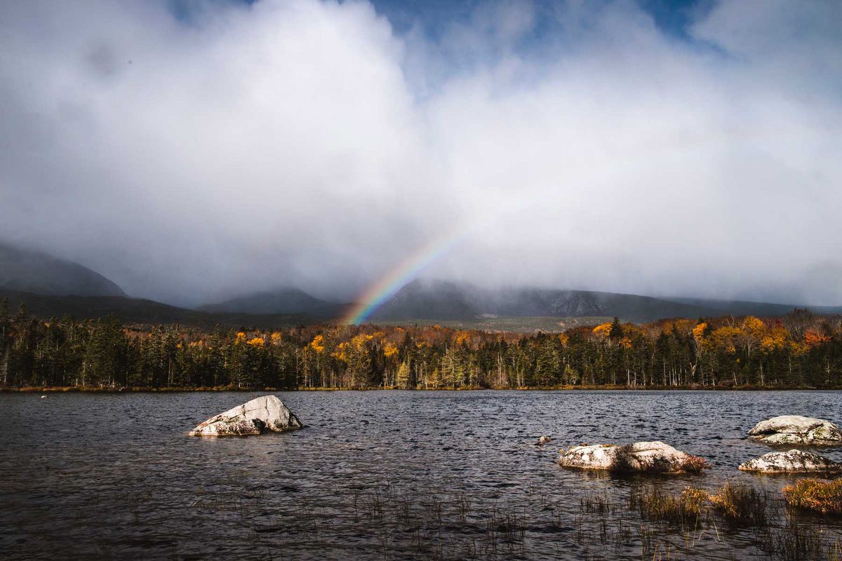 Rainbow forms over Sandy Stream Pond, Baxter State Park, Maine