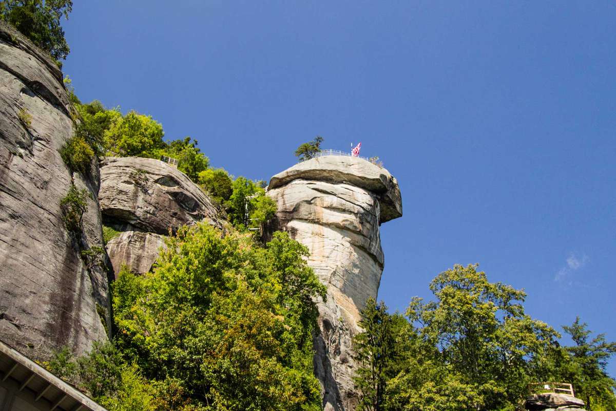 Large rock formation is the namesake of Chimney Rock State Park in Lake Lure, North Carolina, USA.