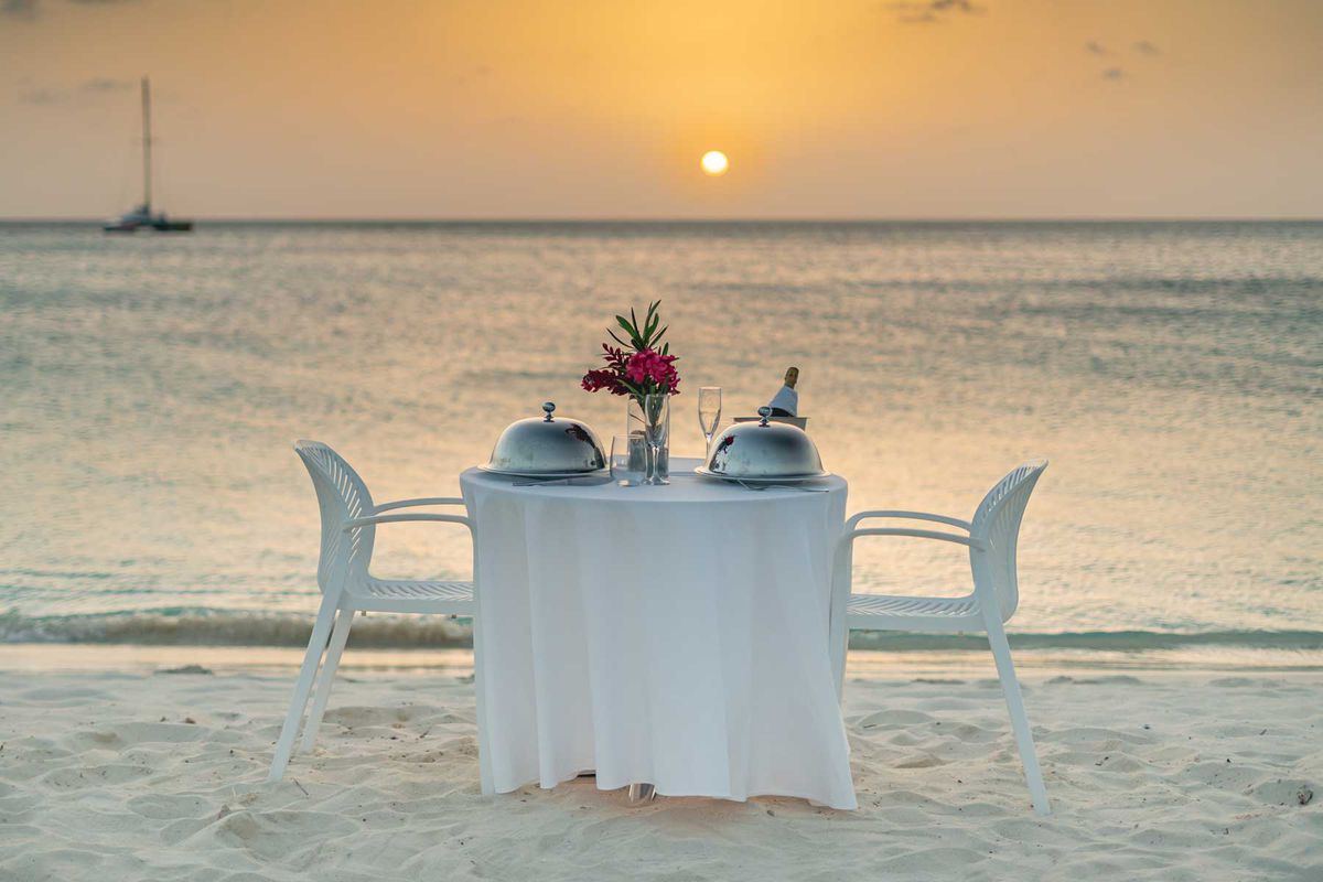 Dinner for two on the beach at sunset in Aruba