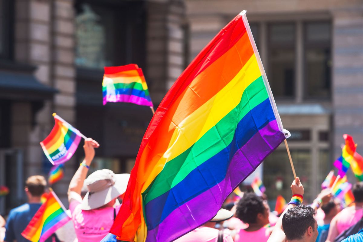 Pride flags being held during parade