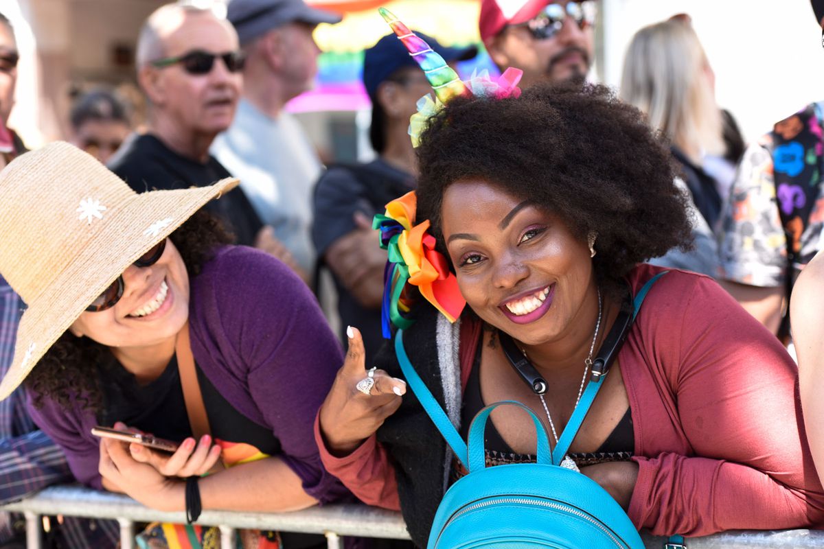 people smiling for the camera during Pride festival