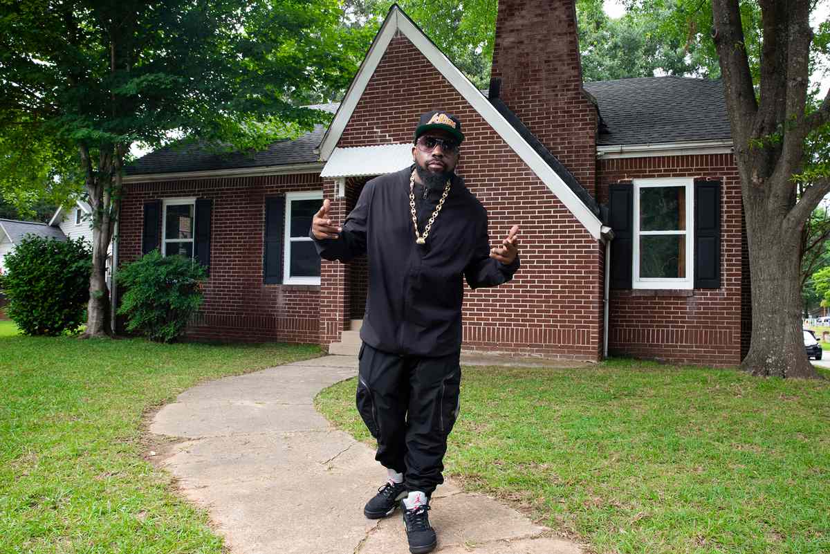 Big Boi in front of the Dungeon Family House in Atlanta