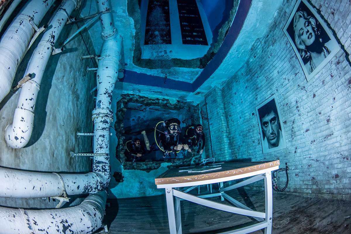Divers at 30m in the sunken city at 12 Deep Dive Dubai