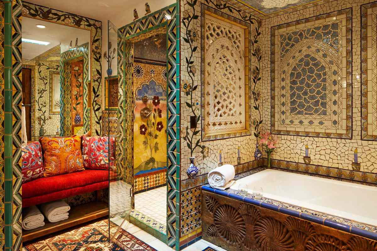 A colorfully-tiled bathroom at Inn of the Five Graces, voted one of the best city hotels in the United States