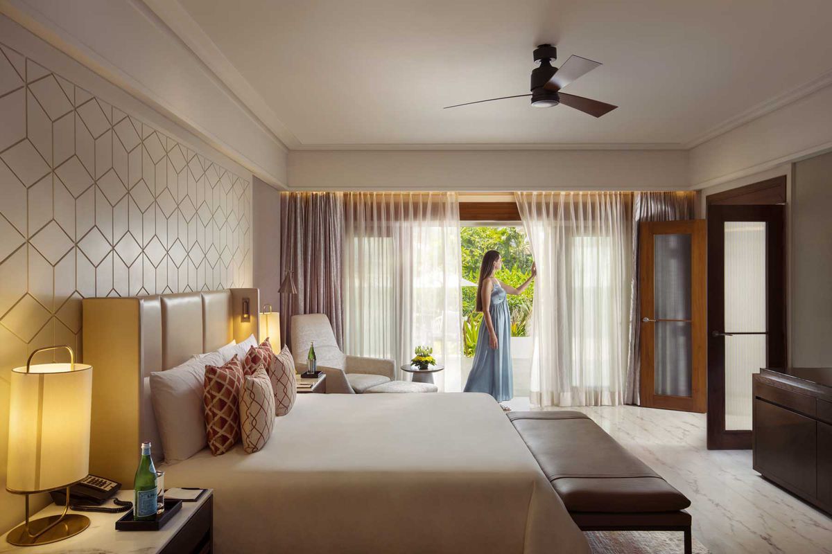A woman in a hotel room at the Leela Palace Goa. Leela was voted the best hotel brand in the world