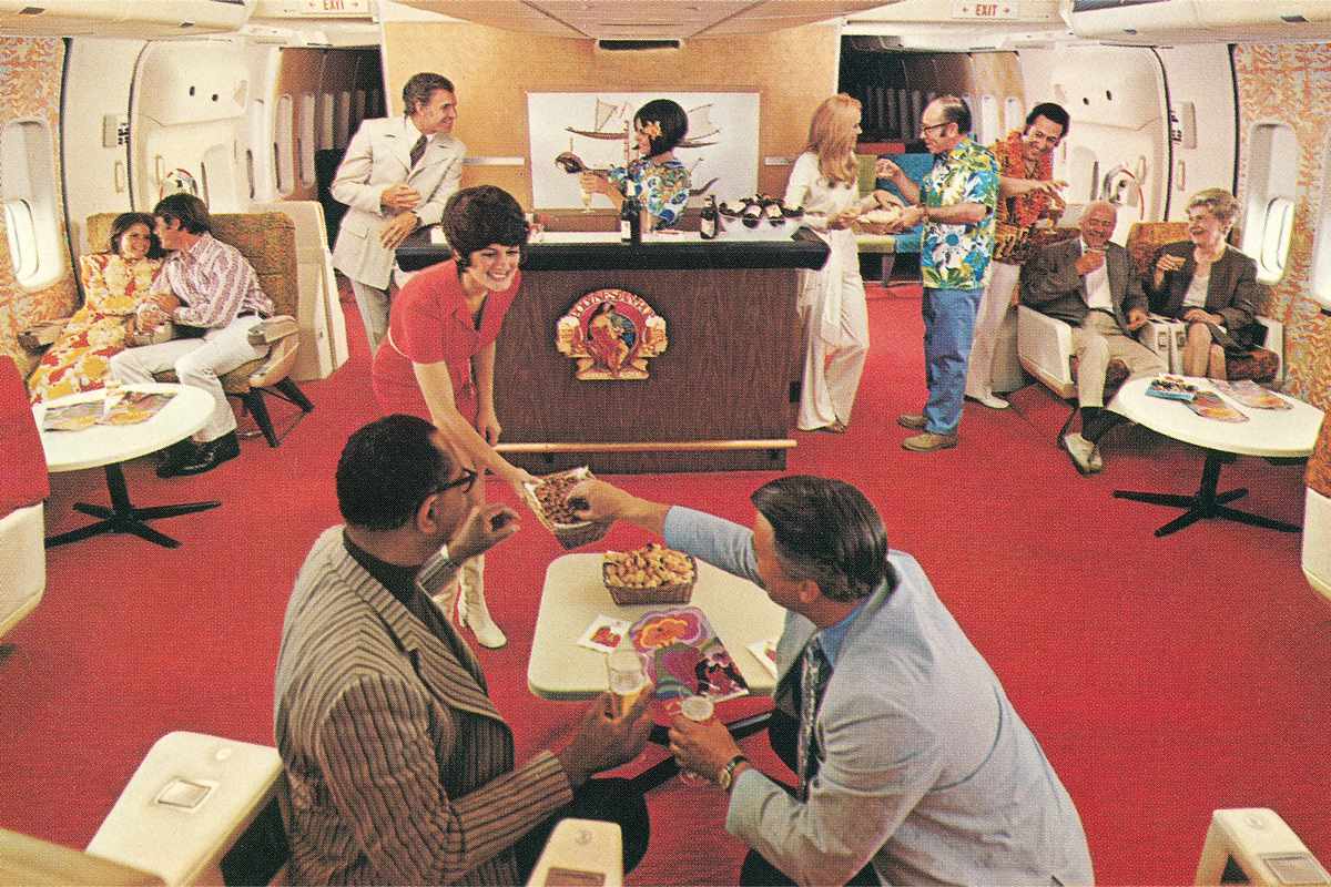 A waitress serving snacks in an airplane Party Lounge.