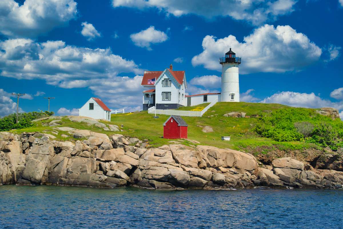 Cape Neddick (Nubble) Light sits on a small rock island known as the Nubble just off the coast of York, Maine.